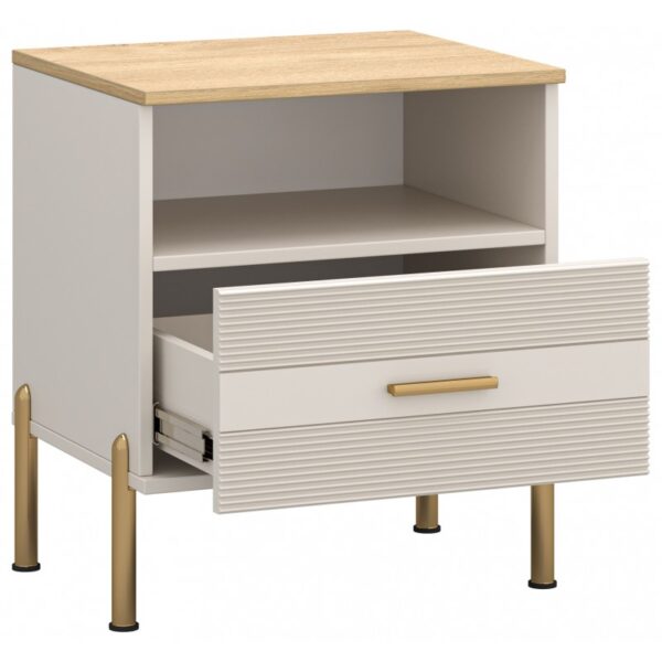 Rubenshafkaprilizhkova1s02800x800 globalmtc White modern bedside cabinet with a wood toned top gold legs an open upper shelf and a partially pulled out ribbed drawer globalmtc