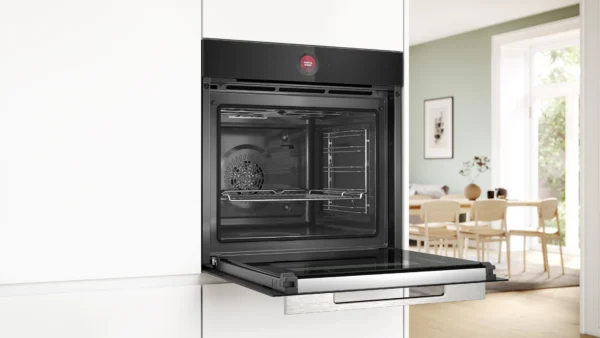Built in stainless steel oven with the door open in a bright modern kitchen Globalmtc