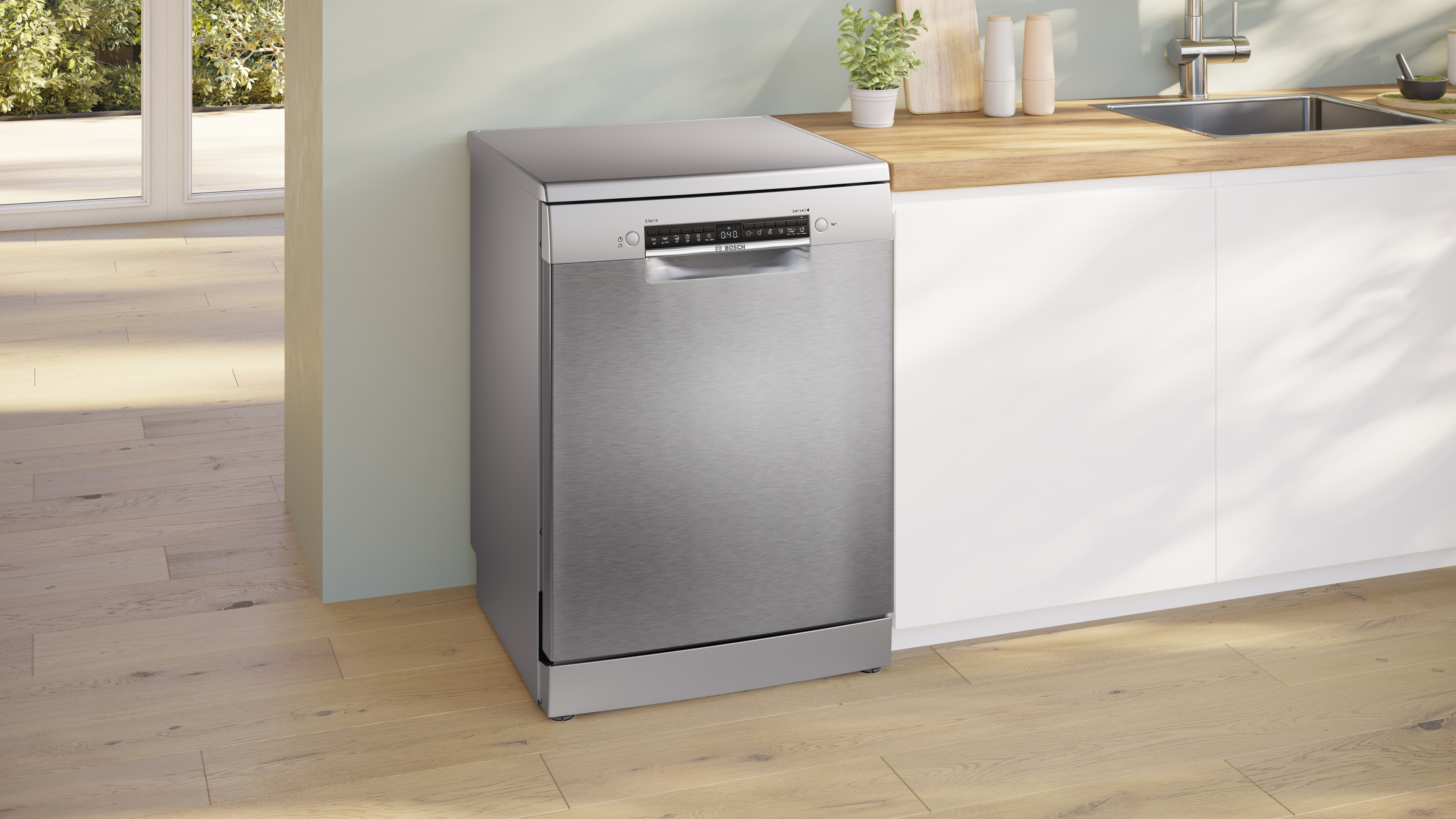 Stainless steel dishwasher beside a wooden kitchen counter in a bright modern kitchen Globalmtc
