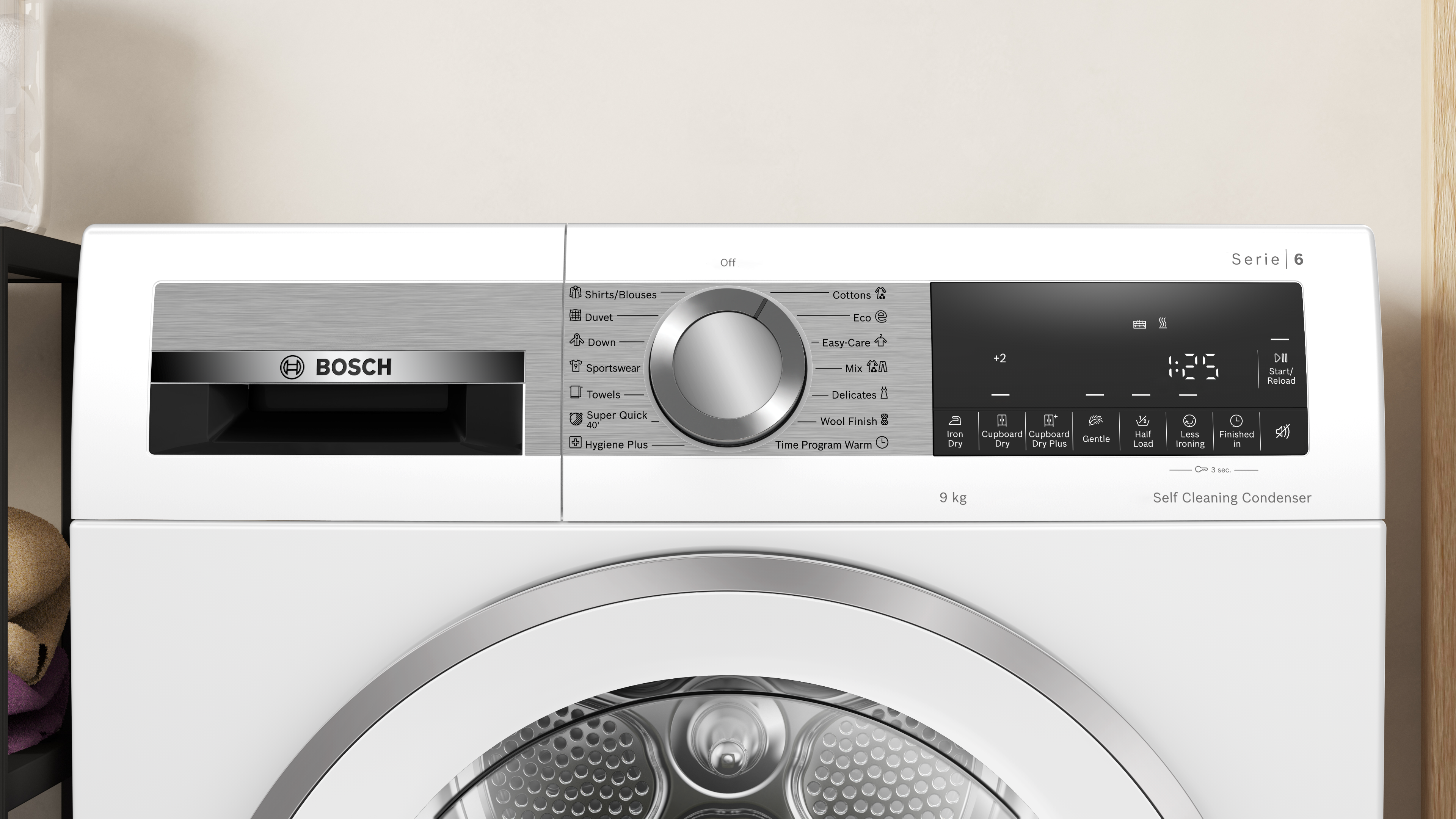 Front-loading Bosch washing machine with a large central program dial and digital display on a brushed-metal control panel