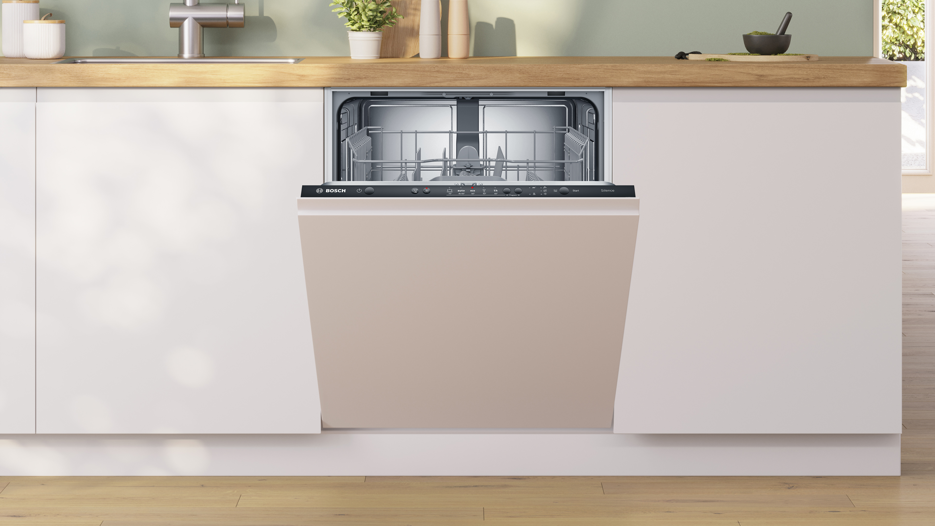 Open bosch dishwasher built into light cabinetry between a wood countertop and white base cabinets with inner racks visible Globalmtc