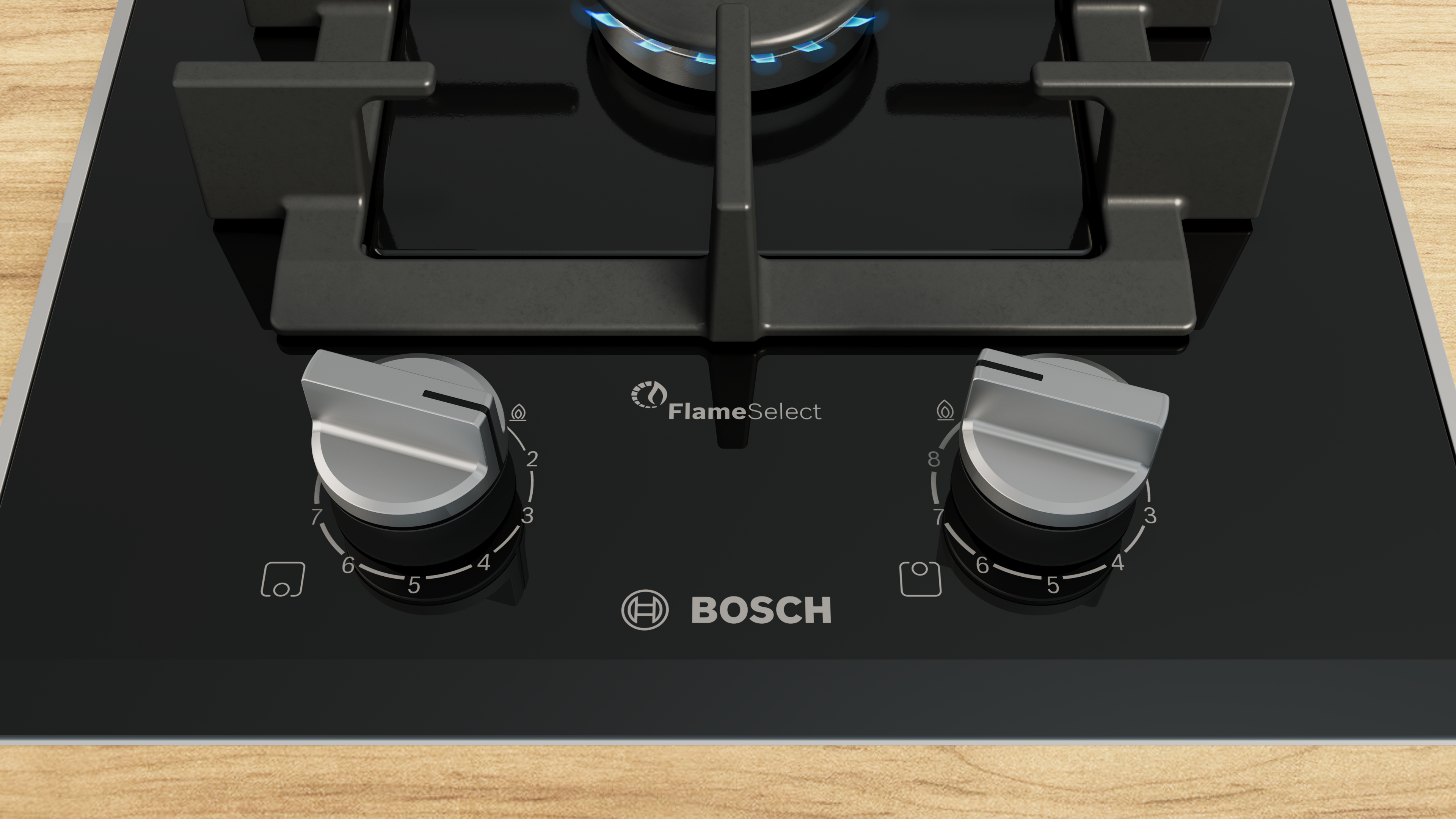 Top down view of a bosch gas stove with two control knobs and a lit burner showing blue flames  globalmtc
