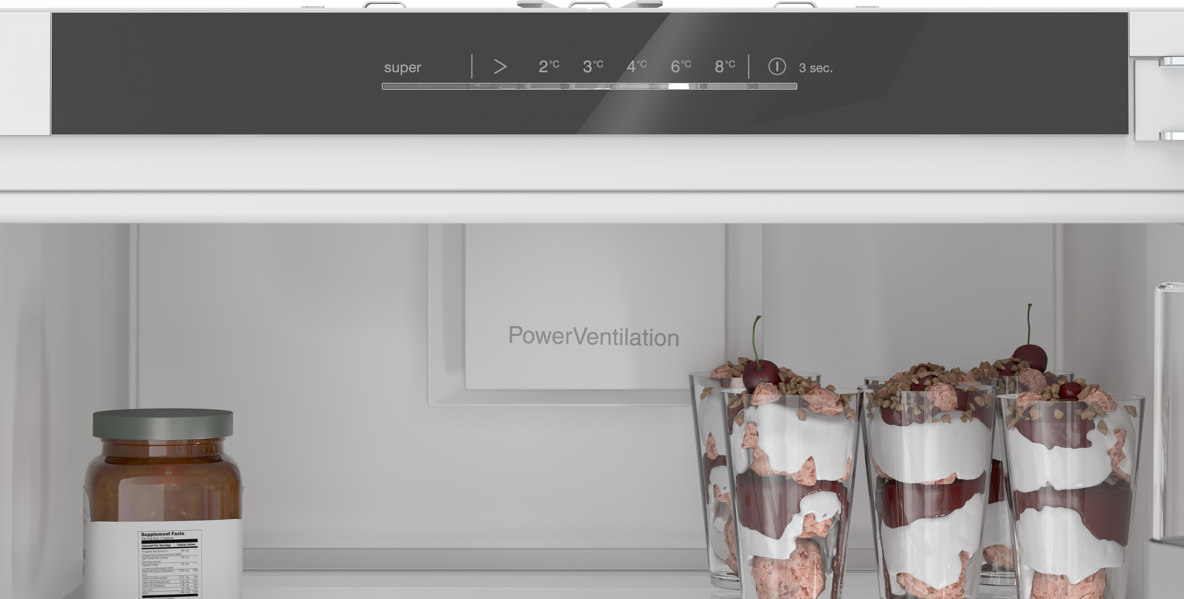 Open refrigerator showing the powerventilation panel a jar of jam on the left and several dessert parfait glasses on the right Globalmtc