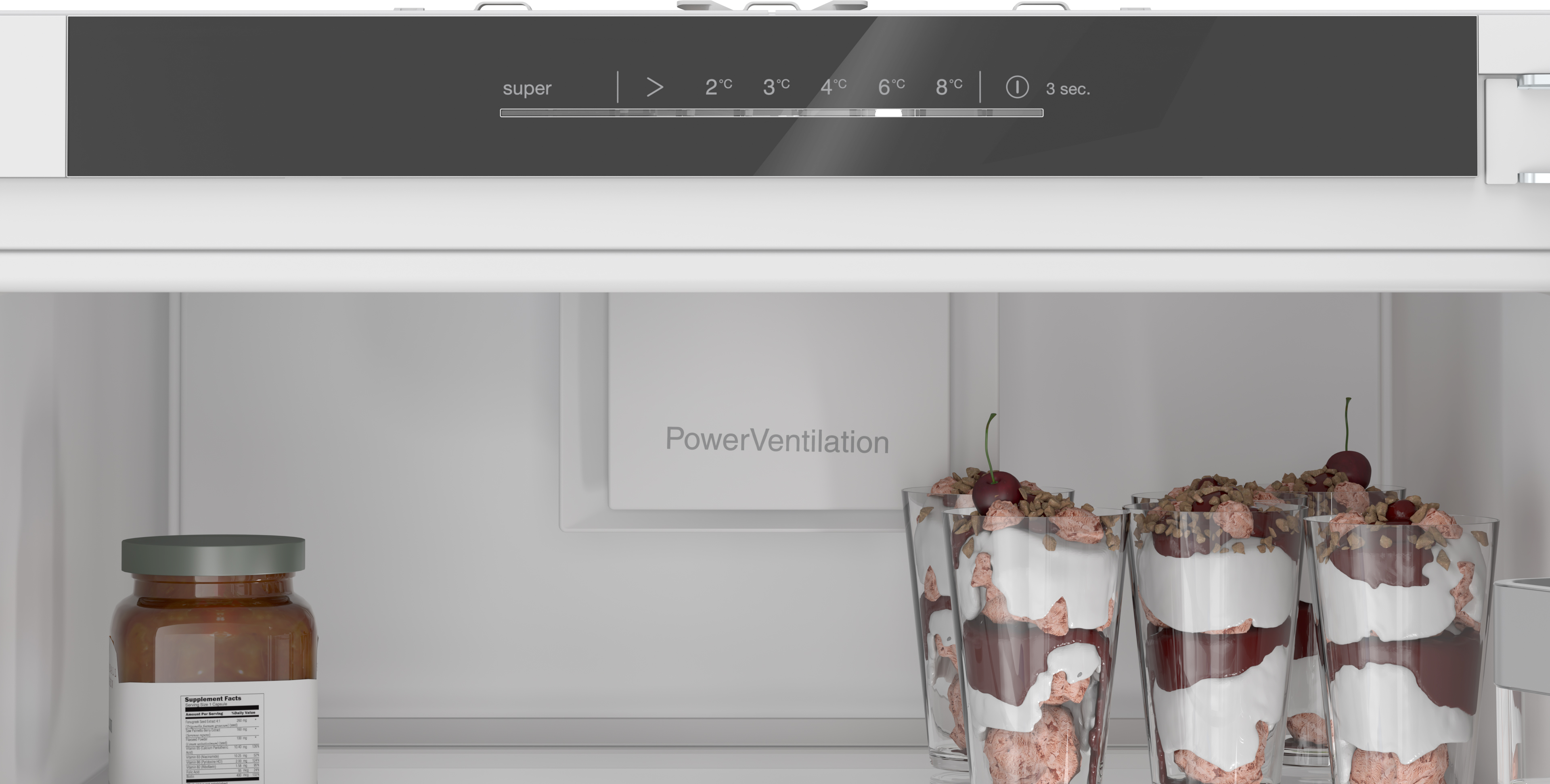 Fridge interior showing a powerventilation panel a jar of jam on the left and dessert parfait glasses on the right Globalmtc
